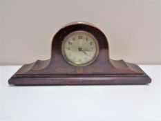 An early 20th century mahogany cased mantel clock with silver dial.