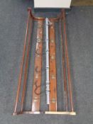 A pair of early twentieth century pine wall mounted coat racks together with hand made metal coat