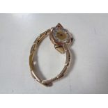 A lady's 9ct gold wristwatch on 9ct on silver bracelet strap.