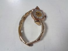 A lady's 9ct gold wristwatch on 9ct on silver bracelet strap.