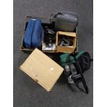 A boxed 8mm projector together with a further box containing cameras, camera bags, video cameras.