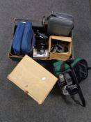 A boxed 8mm projector together with a further box containing cameras, camera bags, video cameras.