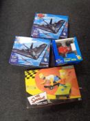 Two boxed Air Hogs RC Dominators together with a further remote controlled vehicle and a Simpson's