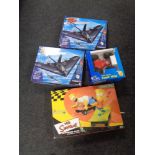 Two boxed Air Hogs RC Dominators together with a further remote controlled vehicle and a Simpson's