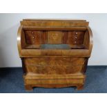 A late 19th century mahogany Empire style cylinder bureau.