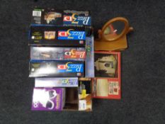 A box containing 3D Jigsaw puzzles, ceramic hair dryer, Stonecraft building kit,