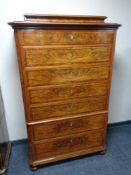 A 19th century continental seven drawer chest on bun feet (as found).