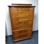 A 19th century continental seven drawer chest on bun feet (as found).