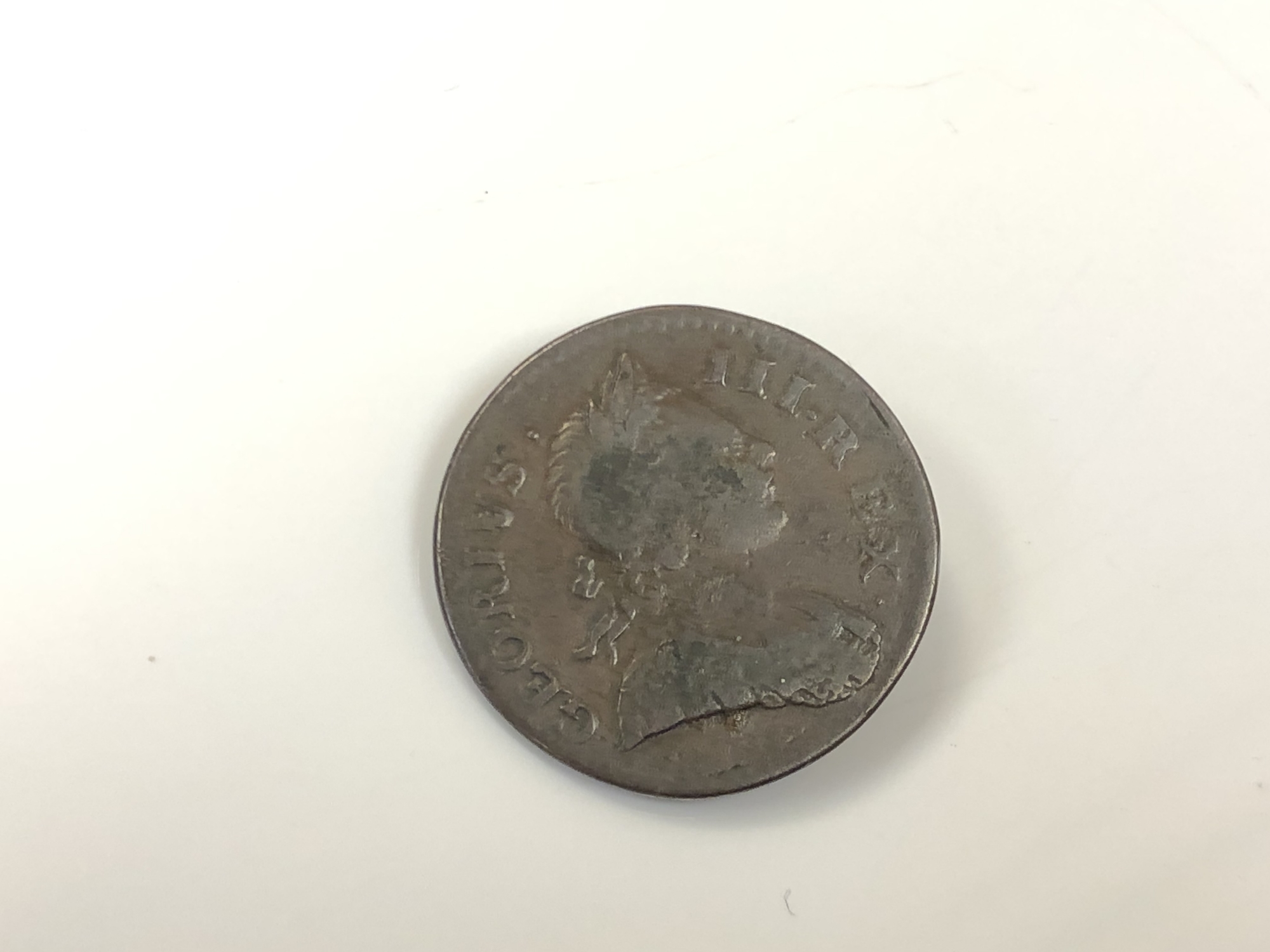 A 1772 half penny (Georgius error).
