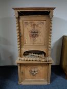 An early 20th century continental oak carved door cabinet,