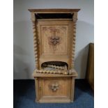 An early 20th century continental oak carved door cabinet,