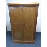 A 20th century double door corner cabinet.