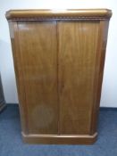 A 20th century double door corner cabinet.