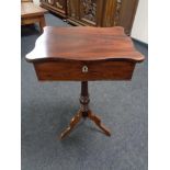 A late nineteenth century sewing table on tripod pedestal