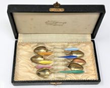 A set of six silver and enamelled teaspoons.