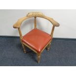 A 20th century oak corner chair.