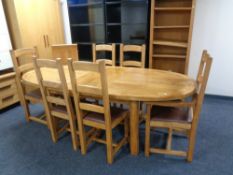 A contemporary oak Chapman's refectory dining table with two leaves and set of six high back chairs
