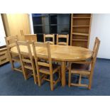 A contemporary oak Chapman's refectory dining table with two leaves and set of six high back chairs