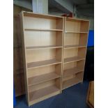 A pair of pine effect office open bookshelves.