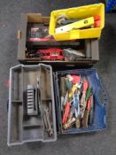 A box containing power tools, extension reel,