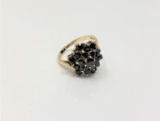 A 9ct gold sapphire cluster ring, size L, 3.4g.