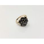 A 9ct gold sapphire cluster ring, size L, 3.4g.