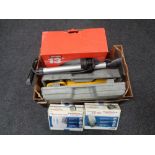 A box containing car accessory kits, cased trolley jack, 13 inch wheel trims, etc.