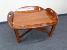 A rectangular butler's tray on stand.