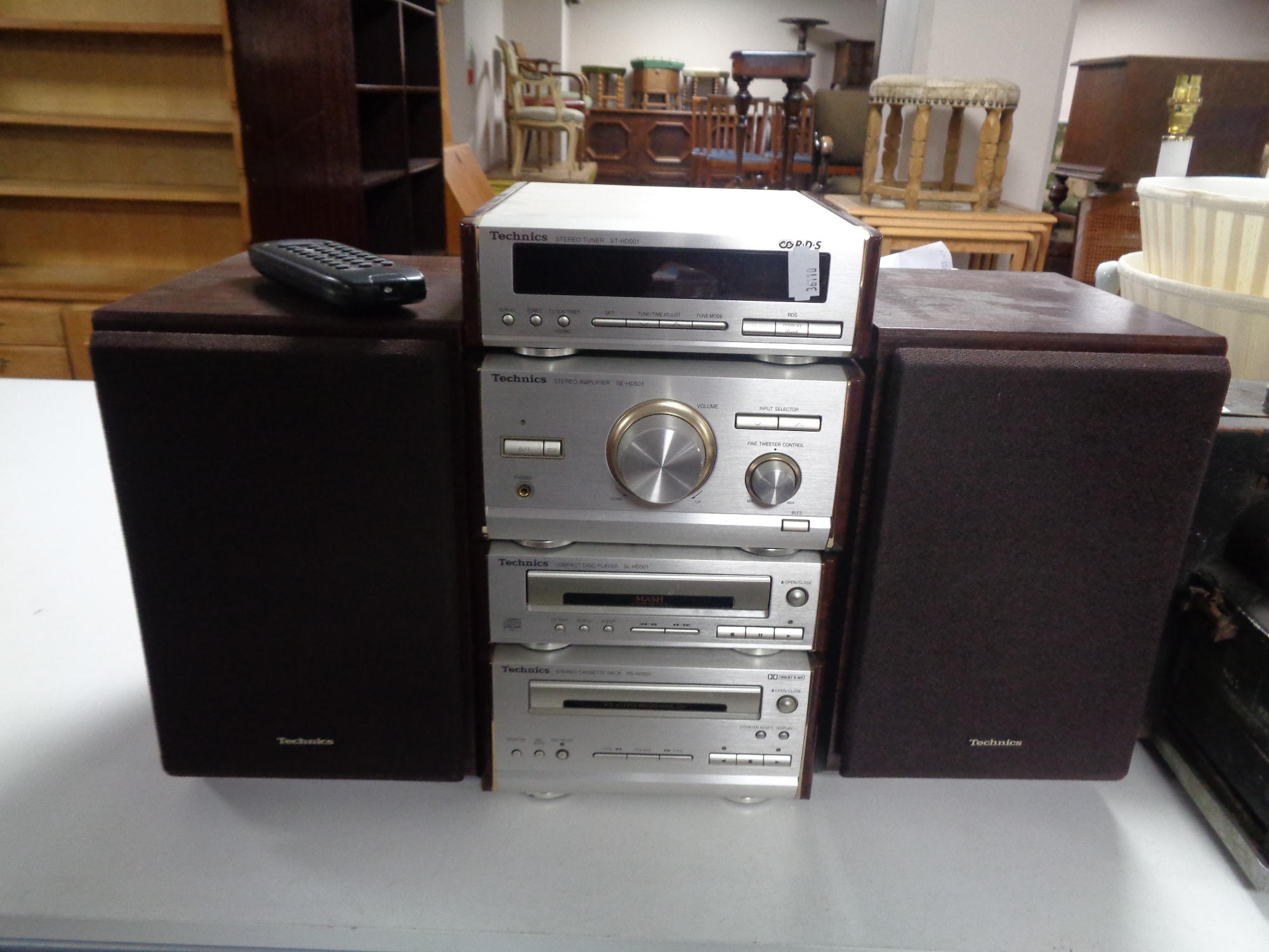 A Technics four piece midi Hi-Fi separates system with speakers and remote.