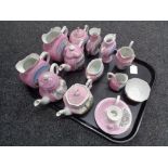 A tray containing antique pink lustre tourist china to include vases, teapots,