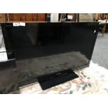 A Sony Bravia 40'' LCD TV with remote.