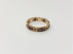 A 9ct gold eternity ring set with sapphires, size M/N, 3.1g.