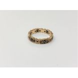 A 9ct gold eternity ring set with sapphires, size M/N, 3.1g.