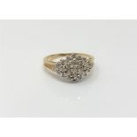 A 9ct gold diamond cluster ring, approximately 0.5ct, size M/N, 3.3g.