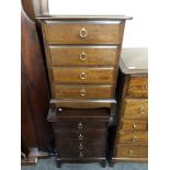 A pair of Stag Minstrel four drawer bedside chests.