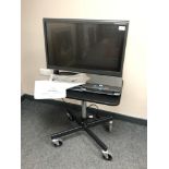 An Optelec ClearView C HD 24'' Speech TFT Video Magnifier on height adjustable trolley,