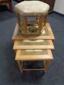 A nest of three blonde oak tile topped coffee tables, together with a blonde oak upholstered stool.