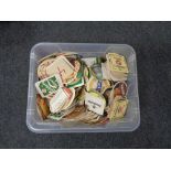 A box containing a large quantity of assorted beer mats.