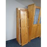 A dismantled pine triple door wardrobe.