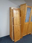 A dismantled pine triple door wardrobe.