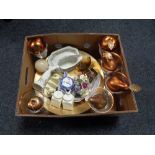 A box containing contemporary wine glasses, glass fruit bow with artificial fruit,