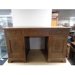 An early 20th century oak twin pedestal desk.