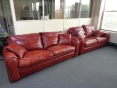 A Duresta red leather three seater settee with matching two seater settee