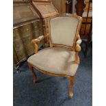 A beech framed dralon upholstered salon style armchair.