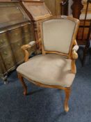A beech framed dralon upholstered salon style armchair.