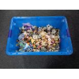 A large plastic crate containing contemporary ornaments to include fairies, teddy bears, etc.