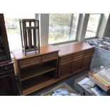 A contemporary teak three door sideboard together with matching shelves and stick stand