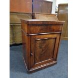 A late 19th century mahogany cabinet, fitted cupboard beneath.