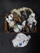 A box containing Star Wars figures, money boxes and inflatable.