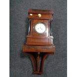 An early 20th century mahogany cased continental bracket clock with shelf.